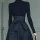 Dark blue turtleneck stretch top and plaid skirt set